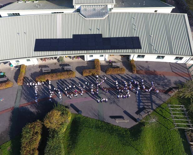 Pupils at Barns Green Primary School near Horsham spelled out the words 'Thank You' after solar panels were installed on the school building. Photo: Gary Pickering