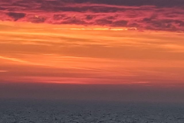 Sunrise over the sea at Eastbourne, taken by Joanne Bolton with a Huawei phone.