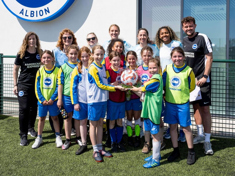 Albion women’s star players Jorelyn Carabali, Vicky Losada and Maisie Symonds with BHAFC Foundation staff and Amex volunteers awarding Goldstone Primary the 'Best Team Spirit' prize