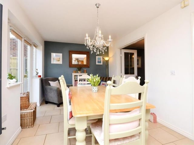 That breakfast table can also double up as the dining table. Here is another view of the dining area at one end of the kitchen, providing the perfect space for evening meals with the family.