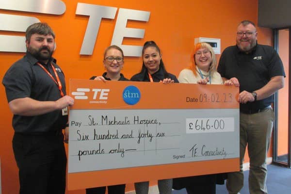 Thomas Woolven, Jenny Dobinson, Georgiana Mitroi and Tom Reid, Plant Manager, present the cheque to Sophie Bailey, St. Michael's Hospice.