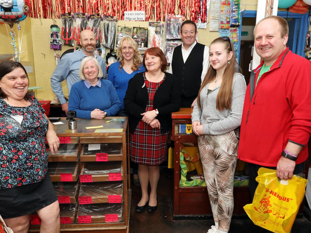 The Searle family including manager Steve Searle, back left, with customers, front left to right, Salina Coleman, Elizabeth Jones, 15, and Andrew Jones at U-Need-Us on its last day of trading in 2019. Picture: Chris Moorhouse (300319-24)