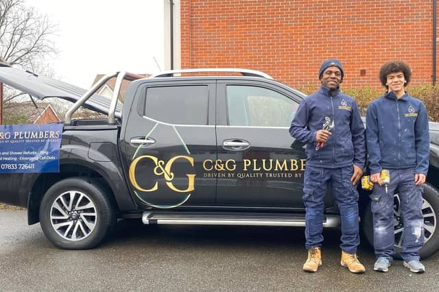 Godfrey Muneri with one of his sons Jay. Photo: C & G Plumbers