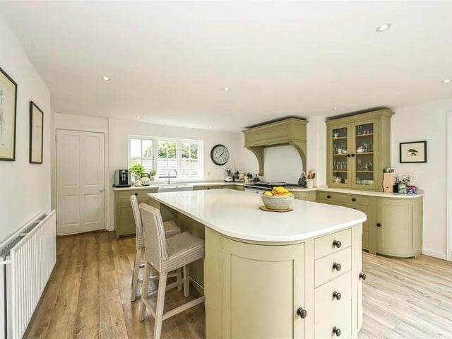 The house has a luxuriously appointed Neptune kitchen with integrated appliances.