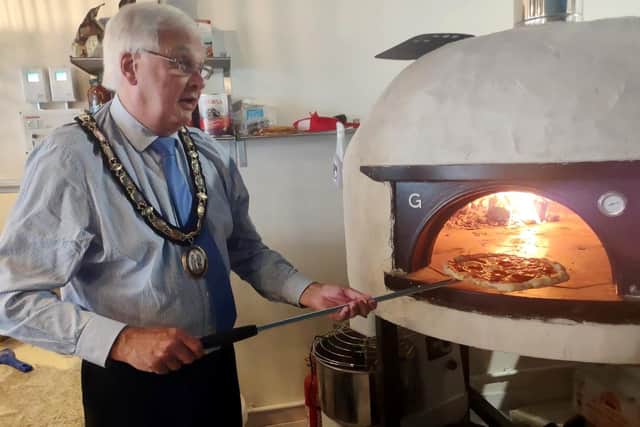 Haywards Heath town mayor Howard Mundin helps make a pizza at The Safari Pizza co, pizzeria and wine bar