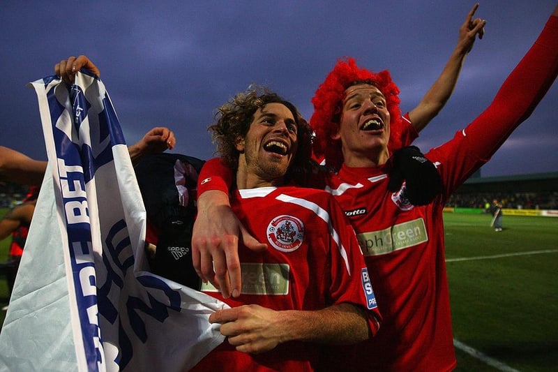 Sergio Torres (l) and Glenn Wilson (r) celebrate Crawley's 1-0 victory against Torquay United.