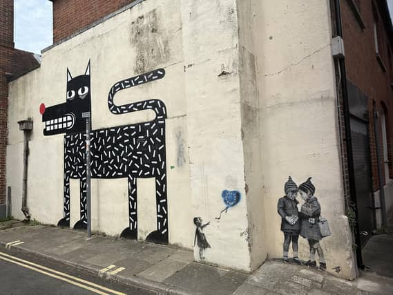 Three pieces of street art in East Pallant, Chichester: The dog is by Joachim, a street artist from Belgium, but the two smaller pieces are by another artist: JPS, from Weston Super-Mare, who cites Banksy as among his inspirations.
