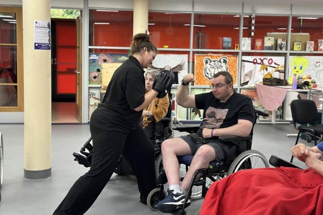 48 year old Royal Engineers veteran Steve Boylan boxing with Rehabilitation Assistant Lisa