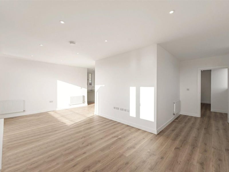The penthouse, on the third floor, has three double bedrooms, a modern kitchen and bathroom, and south-facing terrace with views of the town and beyond