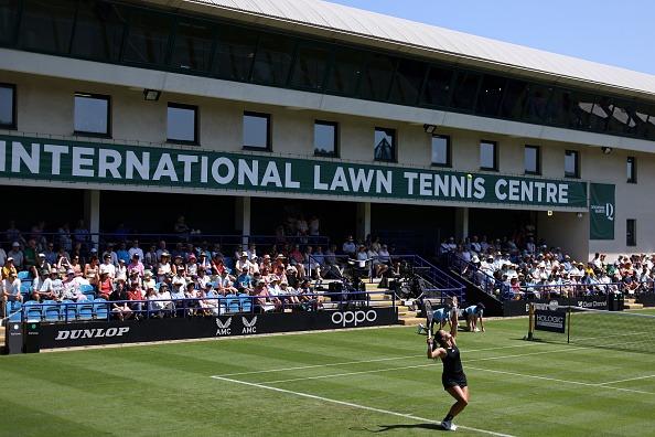 Jodie Burrage of Great Britain in action during her women's singles qualifying match against Jasmine Paolini of Italy during Day Two