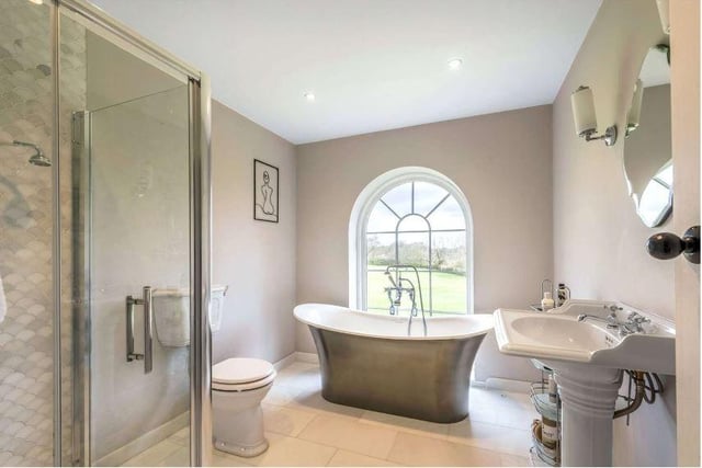 The ensuite to the principal bedroom has stylish fittings