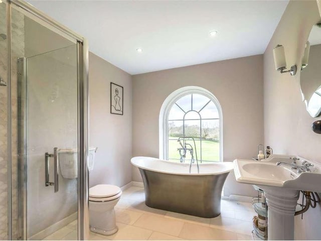 The ensuite to the principal bedroom has stylish fittings