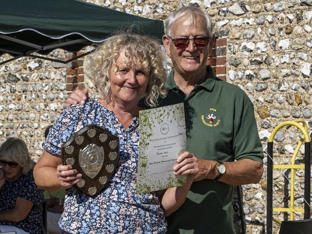 Sarah Hill receives the Ray Brown Memorial Shield from Colin Crane at East Preston and Kingston Horticultural Society flower show