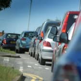 A collision between a van and a car between Uckfield and Crowborough has closed a main road