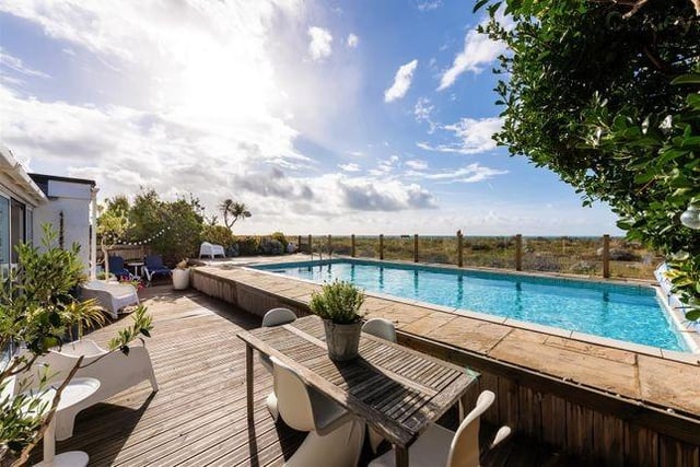 The property has an outdoor heated swimming pool in the garden.