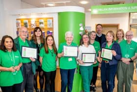 QVH Macmillan Cancer Information and Support Centre team celebrating 11 years of serving the community.