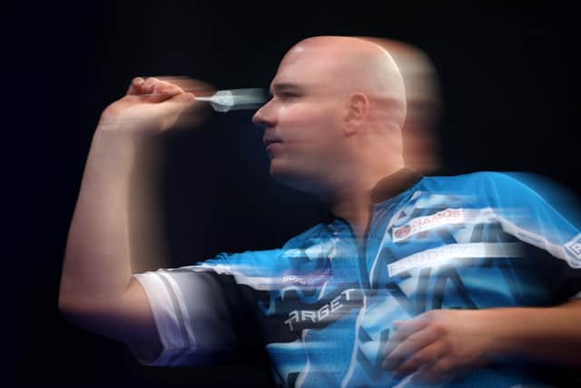 Rob Cross in his first round match against Luke Littler at the BoyleSports World Grand Prix (Photo by Alex Pantling/Getty Images)