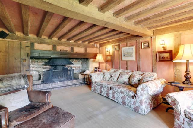 One of the cosy sitting rooms in the historic Tudor property