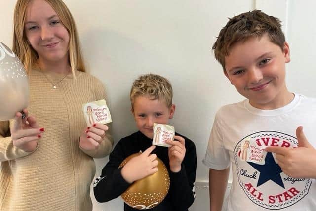 Proud of their mum Abi: children  Lily, 12, Henry, nine, and seven-year-old Tommy Smith