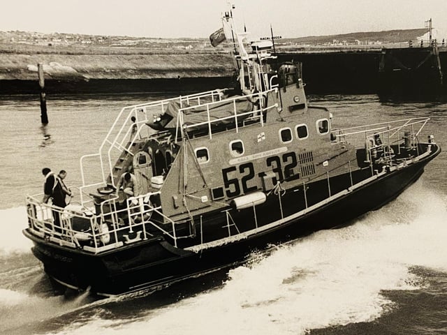 On the morning of 16 October in the wake of the great storm of 1987, telephone lines and radio ariels were down, so when the Mayday from French fishing vessel ‘La Françoise’ was relayed by Solent Coastguard to Newhaven Coastguard, news of the vessel’s predicament was shouted across the river to Newhaven RNLI's 'Keith Anderson' (featured), busy helping the marina recover boats and pontoons that had been swept across the harbour by the storm. A Framed Letter of Thanks signed by the Chairman of the Institution was awarded to Coxswain Len Patten in recognition of his perseverance and expert boat handling, rescuing ‘La Françoise’ and her crew of five. A Letter of Commendation from the Director was sent to the crew for their very considerable part in the rescue. A Letter of Appreciation from the Chief of Operations was sent to Mike Tubb for his help as interpreter. Crew on 16 October 1987: Len Patten (Coxswain), Paddy Boyle (Second Coxswain), Mike Beach (Mechanic), Chris Bird, Phill Corsi, Nick Gentry, Ian Johns.