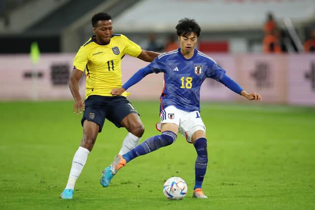 Albion winger Kaoru Mitoma (right) battles for possession with Michael Estrada of Ecuador. Picture by Alex Grimm/Getty Images