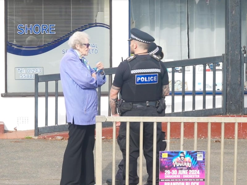 Sussex Police officers speaking with residents of Barnham.