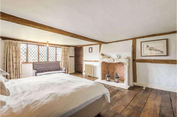 There are five bedrooms on the first floor, including the generous principal bedroom which features an elegant carved stone Chesneys fireplace, and a beautifully fitted en suite bathroom with Lefroy Brooks suite including a roll-top bath and twin basins.