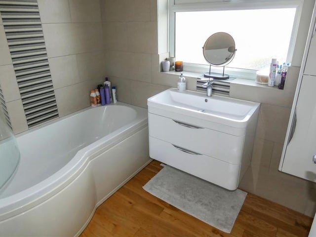 The bathroom and adjacent toilet are separate