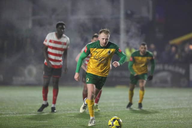 James Hammond steps up to fire home Horsham's third against Kingstonian. Picture by John Lines