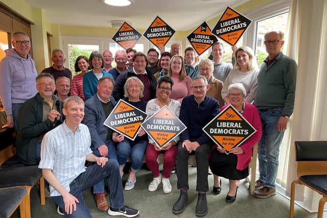 Harsha Desai sits front and centre with a Lib Dem sign with her Chichester colleagues