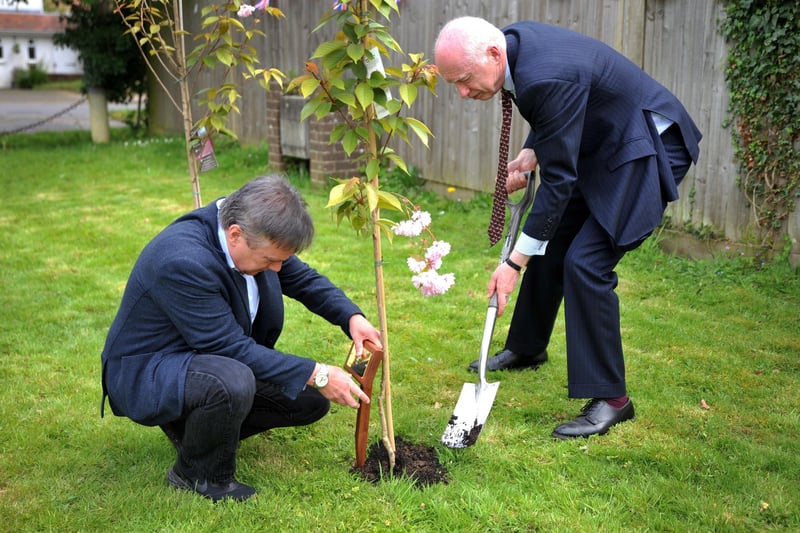 Henry Smith MP and Andy Bliss QPM The High Sheriff of West Sussex at the official commemoration of three cherry trees at Crawley Hospital. Pic S Robards SR2305041