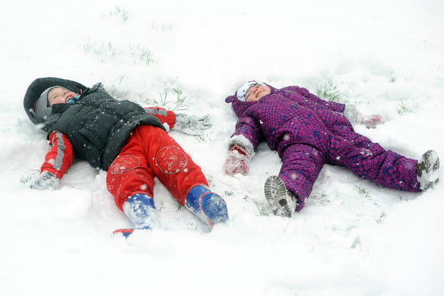 January 2013, two young children enjoy the snow in Horsham Park -photo by Steve Cobb