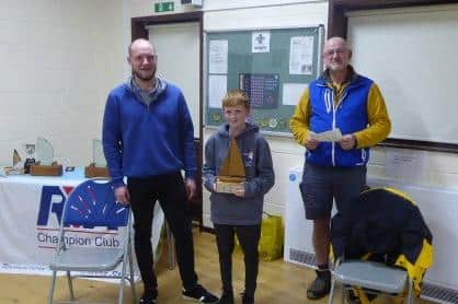 George Parker, who achieved the RYA Young Sailors’ Scheme Stage 2, with RYA senior instructor Max Clarke, left, and principal Rob Elliott