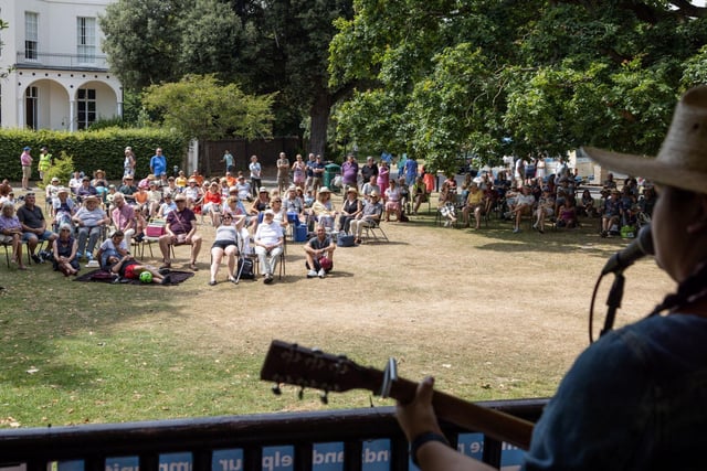 Music lovers took shade under trees to watch the show