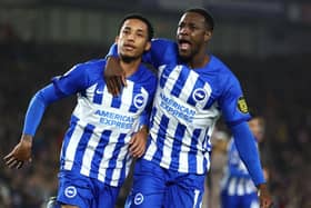 BRIGHTON, ENGLAND - DECEMBER 28: Joao Pedro of Brighton & Hove Albion celebrates after scoring their team's second goal from a penalty kick with teammate Danny Welbeck during the Premier League match between Brighton & Hove Albion and Tottenham Hotspur at American Express Community Stadium on December 28, 2023 in Brighton, England. (Photo by Bryn Lennon/Getty Images)