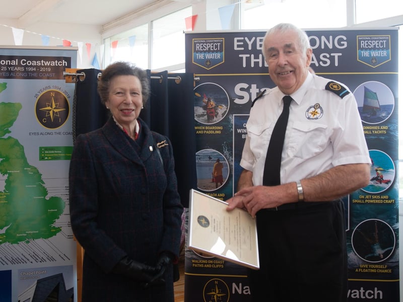 Volunteer watchkeeper Mike Hobbs receiving his 15-year long service award
