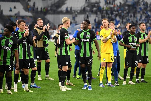 Jan Paul van Hecke and Danny Welbeck of Brighton & Hove Albion shake hands as the team acknowledges the fans