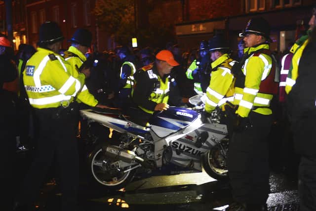 Sussex Police said a 31-year-old man from Brighton was arrested on suspicion of road traffic offences after officers responded to a motorcycle rider in Lewes High Street at about 7pm. Pictures by Jon Rigby