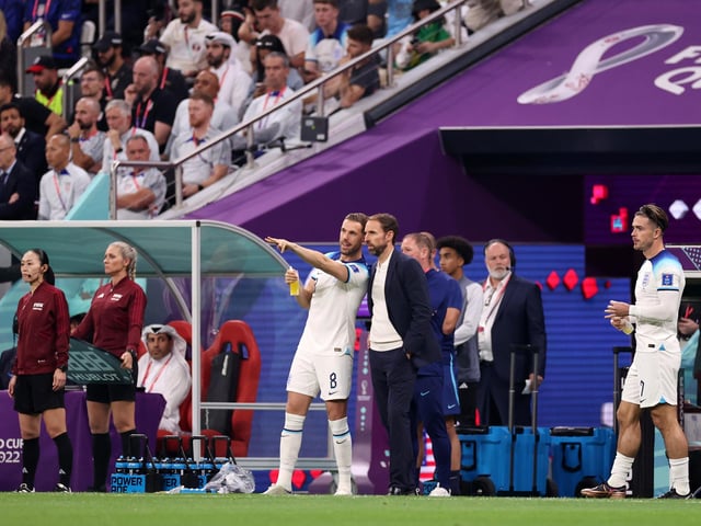 AL KHOR, QATAR - NOVEMBER 25: Gareth Southgate, Head Coach of England, speaks with Jordan Henderson during the FIFA World Cup Qatar 2022 Group B match between England and USA at Al Bayt Stadium on November 25, 2022 in Al Khor, Qatar. (Photo by Ryan Pierse/Getty Images)