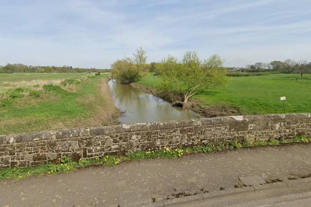 People are advised to avoid roads that flood, including the A281 at Mock Bridge. Photo: Google Street View