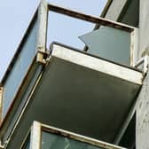 Broken glass on one of the balconies at Kennedy Court, St Leonards. Picture: Phil Scott