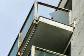 Broken glass on one of the balconies at Kennedy Court, St Leonards. Picture: Phil Scott