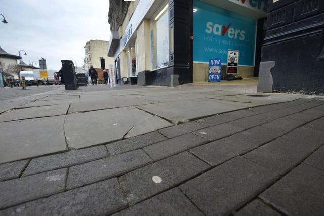 Photo showing the state of the pavement in Hastings town centre. 31/1/24. Queens Road.