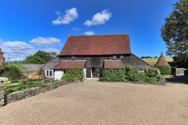 The property has a range of outbuildings including a gym and office, a cottage and converted barn