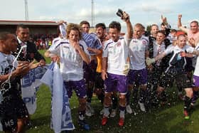 Crawley Town celebrate promotion to the Football League after victory over Tamworth at The Lamb Ground on April 9, 2011.