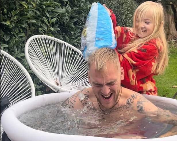 Esmie from Uckfield helping her dad Josh with his ice bath challenge