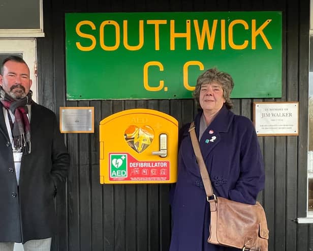 Robina Baine, a Labour councillor for Southwick Green on Adur District Council, and Karl Tilling of Brighton Fire Alarms with the new defibrillator