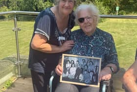 Barbara is all smiles as activities coordinator Shelagh presents her with a framed photograph from her days as a nanny to Lord and Lady Pakenham and their eight children.