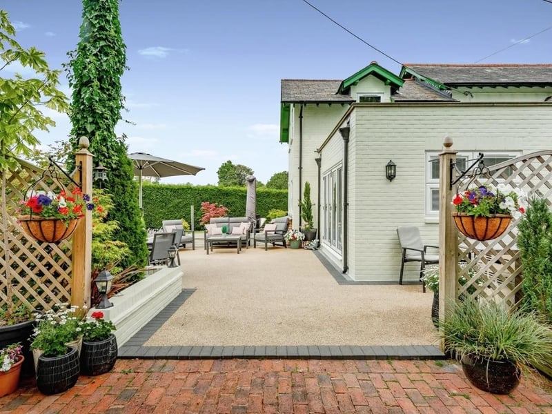 The large paved patio to rear can be used for alfresco dining