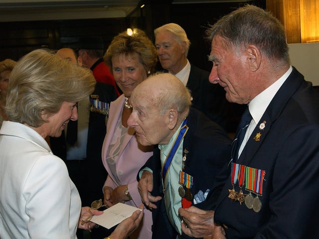 The Duchess of Gloucester on her 60th birthday, chatting with Henry Allingham and Dennis Goodwin